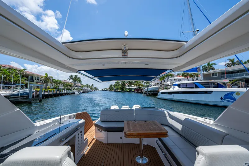  Yacht Photos Pics 2020 Sea Ray SLX 400 boat interior with open deck, docked in a sunny marina.