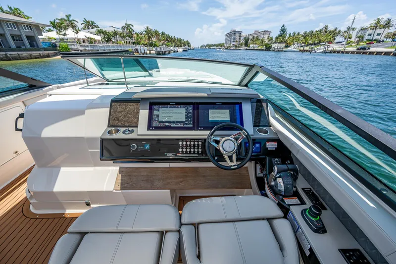  Yacht Photos Pics 2020 Sea Ray SLX 400 helm with modern controls and waterfront view.