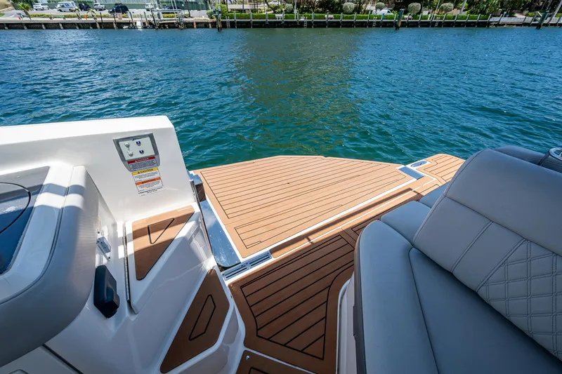  Yacht Photos Pics 2020 Sea Ray SLX 400 boat deck with luxurious seating and water view.