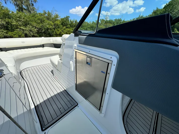  Yacht Photos Pics 2020 Cobalt R30 boat interior with seating and storage compartment.