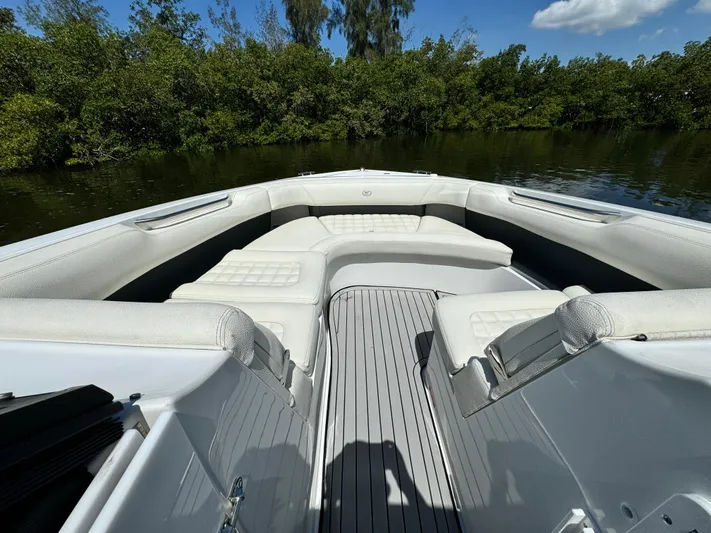  Yacht Photos Pics 2020 Cobalt R30 boat with spacious seating on a calm river.