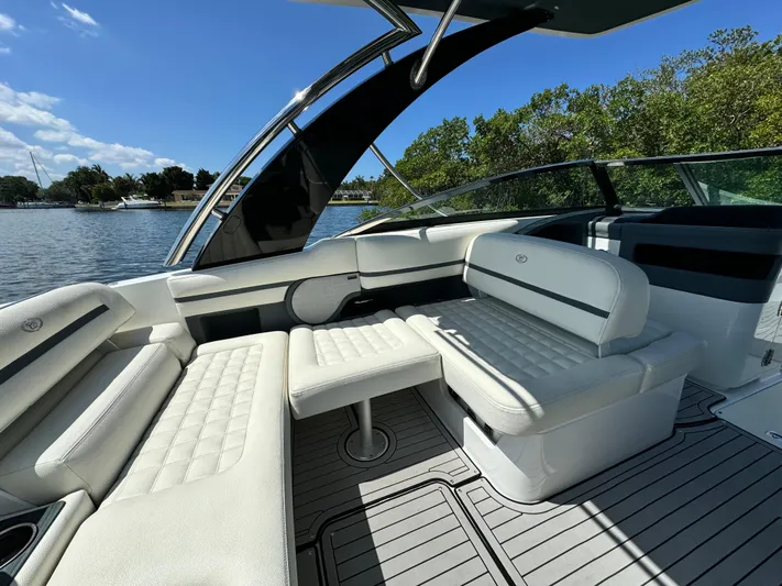  Yacht Photos Pics 2020 Cobalt R30 boat interior with white leather seating and scenic water view.