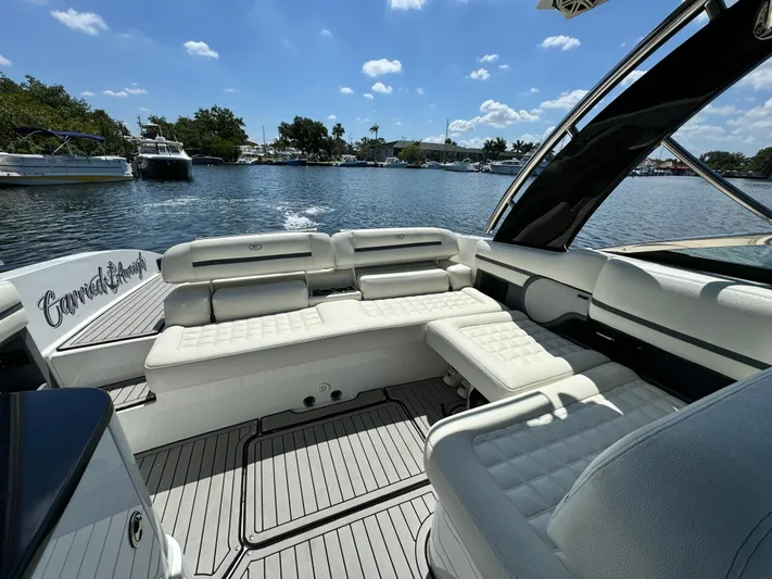  Yacht Photos Pics 2020 Cobalt R30 boat interior with white seating on a sunny day.