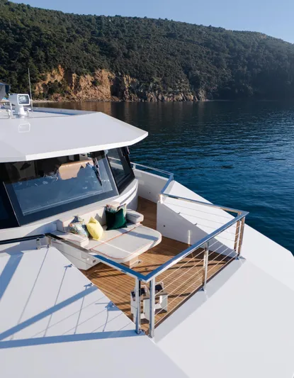 King Benji Yacht Photos Pics Luxurious 2024 Dunya Yacht with scenic ocean view and elegant deck seating.