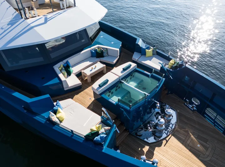 King Benji Yacht Photos Pics Luxurious 2024 Dunya Yacht with spacious deck, hot tub, and elegant seating area.