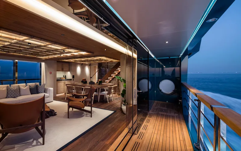 King Benji Yacht Photos Pics Luxurious 2024 Dunya Yachts interior with elegant seating, dining area, and ocean view.