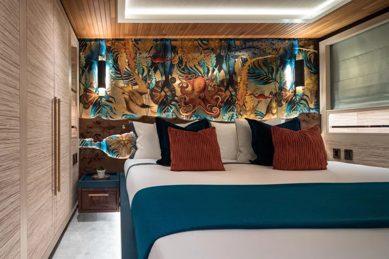 King Benji Yacht Photos Pics Luxurious 2024 Dunya Yachts bedroom with vibrant decor and elegant lighting.