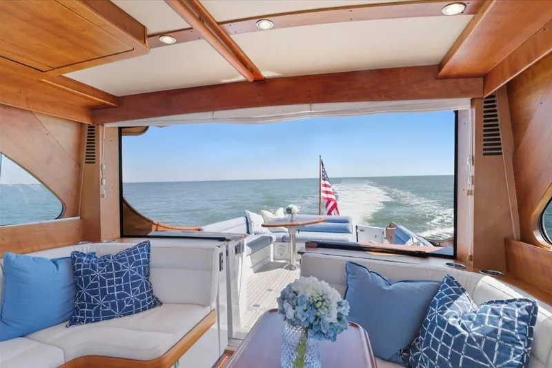 Jeannius II Yacht Photos Pics Luxurious interior of 2015 Hinckley Talaria 43 yacht with ocean view.