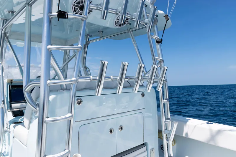  Yacht Photos Pics 2023 SeaVee 390Z boat with rod holders, ocean view, and clear blue sky.