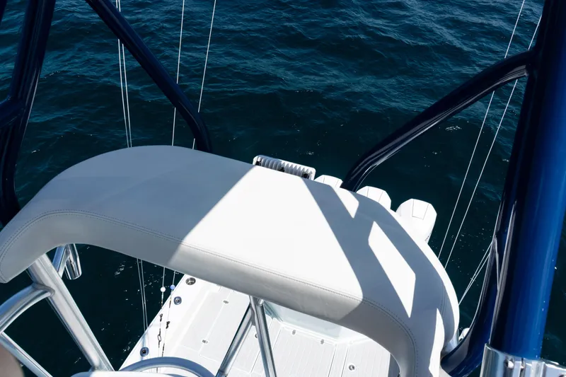  Yacht Photos Pics 2023 SeaVee 390Z boat with white seating, overlooking deep blue ocean waters.