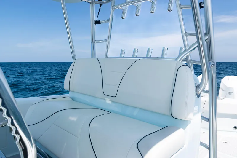  Yacht Photos Pics 2023 SeaVee 390Z boat with white seating, ocean backdrop, and rod holders.