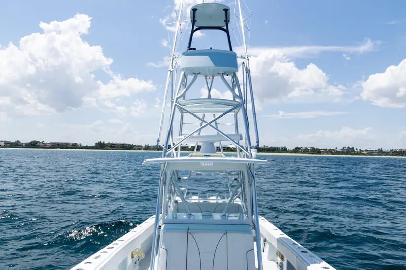  Yacht Photos Pics 2023 SeaVee 390Z boat on open water under a clear blue sky.