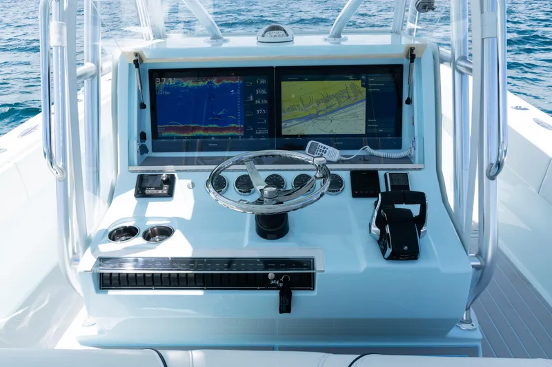  Yacht Photos Pics 2023 SeaVee 390Z boat console with advanced navigation and control systems on open water.