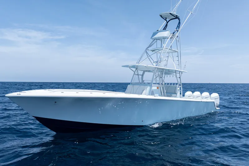  Yacht Photos Pics 2023 SeaVee 390Z boat cruising on open ocean under clear blue sky.