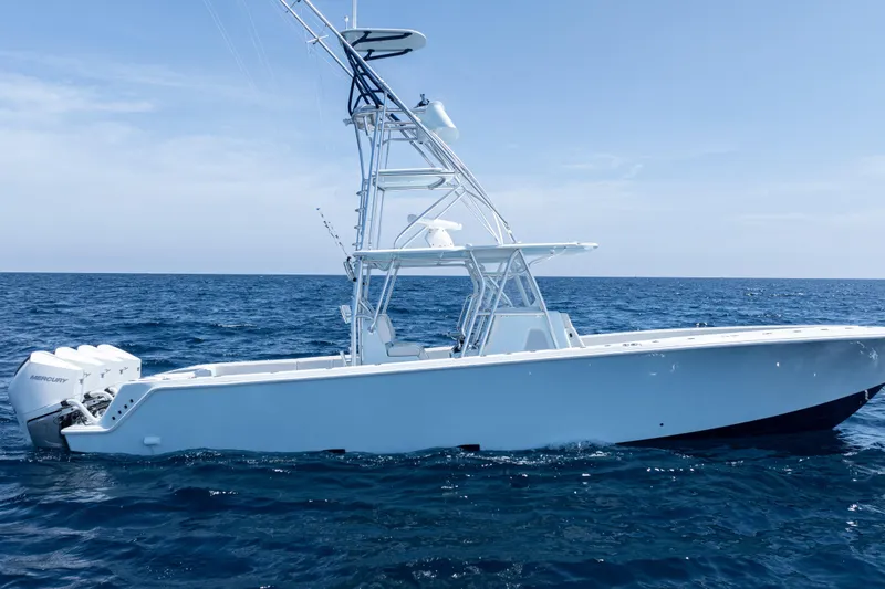  Yacht Photos Pics 2023 SeaVee 390Z boat on open ocean, featuring Mercury engines and sleek design.