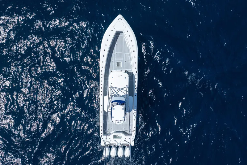  Yacht Photos Pics Aerial view of 2023 SeaVee 390Z boat cruising on deep blue ocean waters.