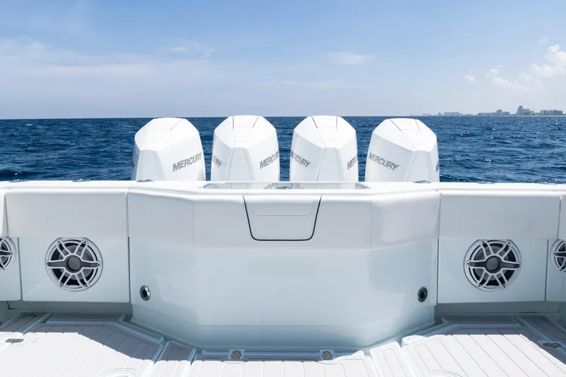 Yacht Photos Pics 2023 SeaVee 390Z boat with four Mercury engines, ocean view in the background.