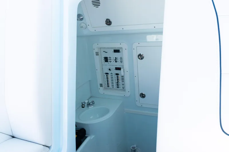  Yacht Photos Pics Interior view of 2023 SeaVee 390Z boat's control panel and sink area.