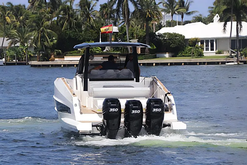  Yacht Photos Pics 2023 Astondoa 377 Coupe Outboard cruising on a scenic waterway.