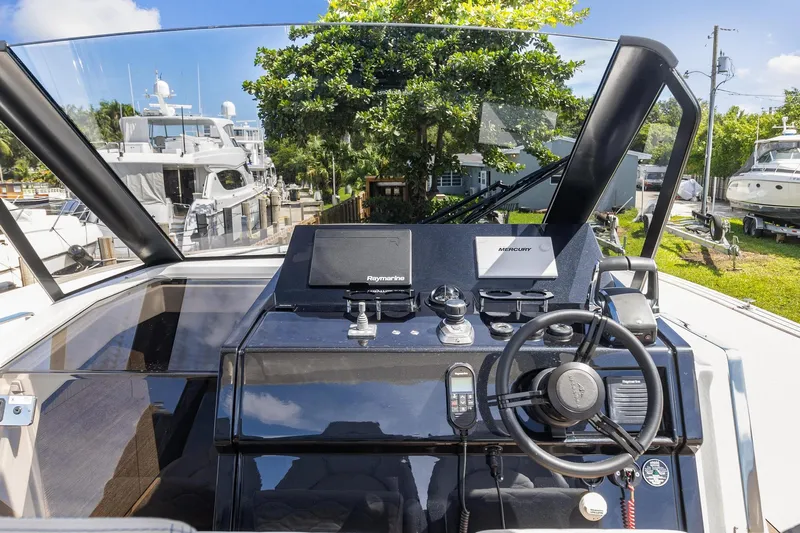  Yacht Photos Pics 2023 Astondoa 377 Coupe Outboard helm station with modern navigation equipment.