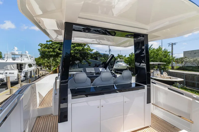  Yacht Photos Pics 2023 Astondoa 377 Coupe Outboard, luxury yacht interior with modern helm station.