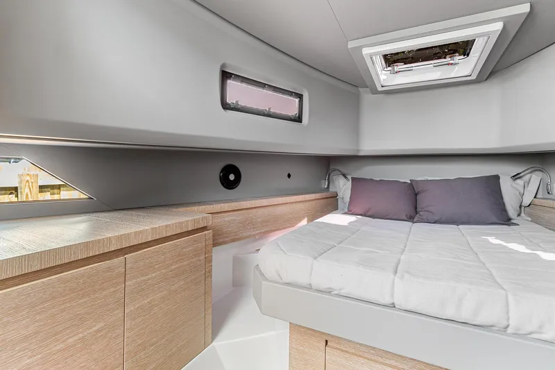  Yacht Photos Pics 2023 Astondoa 377 Coupe Outboard cabin interior with bed and modern furnishings.