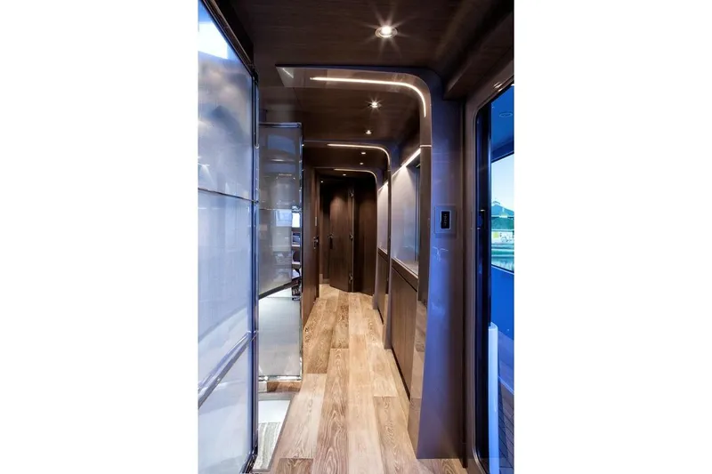 Serenity Yacht Photos Pics Luxurious hallway interior of 2018 Westport Raised Pilothouse yacht with modern lighting.
