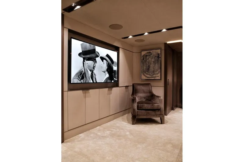 Serenity Yacht Photos Pics Luxurious interior of 2018 Westport Raised Pilothouse yacht with plush seating and wall art.