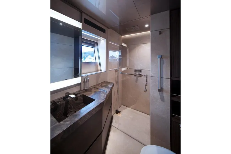 Serenity Yacht Photos Pics Luxurious bathroom in 2018 Westport Raised Pilothouse yacht with modern fixtures and elegant design.