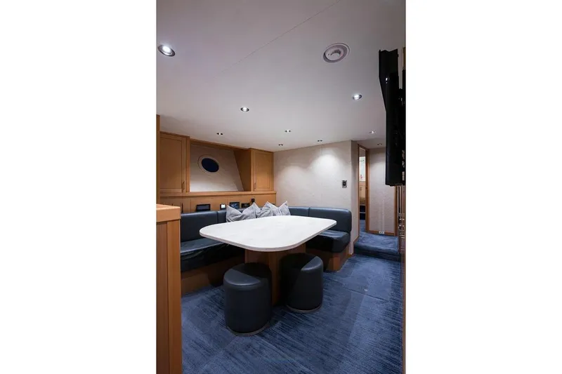 Serenity Yacht Photos Pics Luxurious interior of 2018 Westport Raised Pilothouse yacht with elegant dining area.