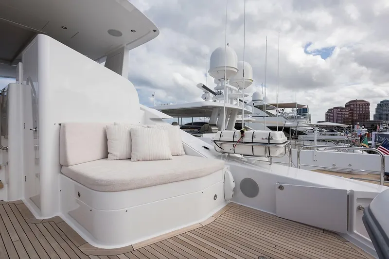 Serenity Yacht Photos Pics Luxurious 2018 Westport Raised Pilothouse yacht deck with seating, docked at marina.
