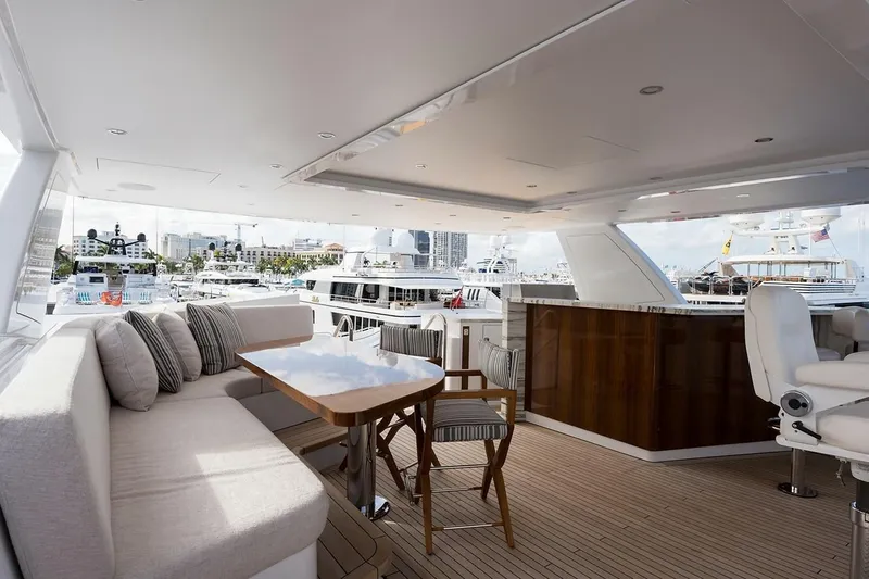 Serenity Yacht Photos Pics Luxurious 2018 Westport Raised Pilothouse yacht interior with elegant seating and marina view.