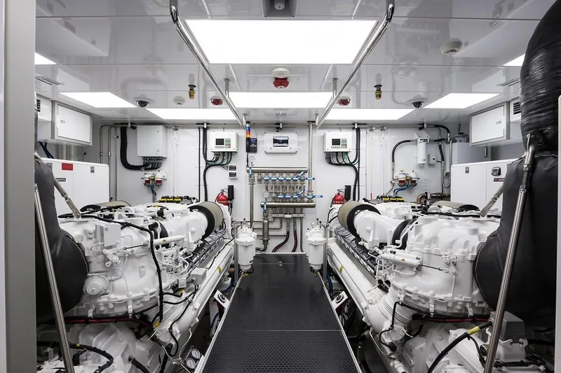 Serenity Yacht Photos Pics Engine room of 2018 Westport Raised Pilothouse yacht, featuring dual engines and modern equipment.