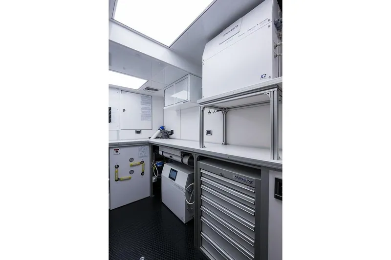 Serenity Yacht Photos Pics Engine room of 2018 Westport Raised Pilothouse yacht with modern equipment and storage.