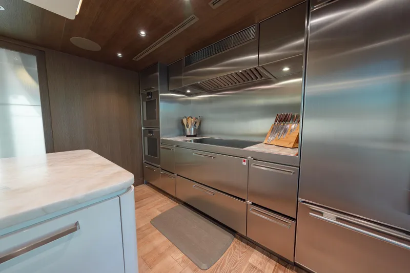 Serenity Yacht Photos Pics Luxurious kitchen in 2018 Westport Raised Pilothouse yacht with stainless steel appliances.