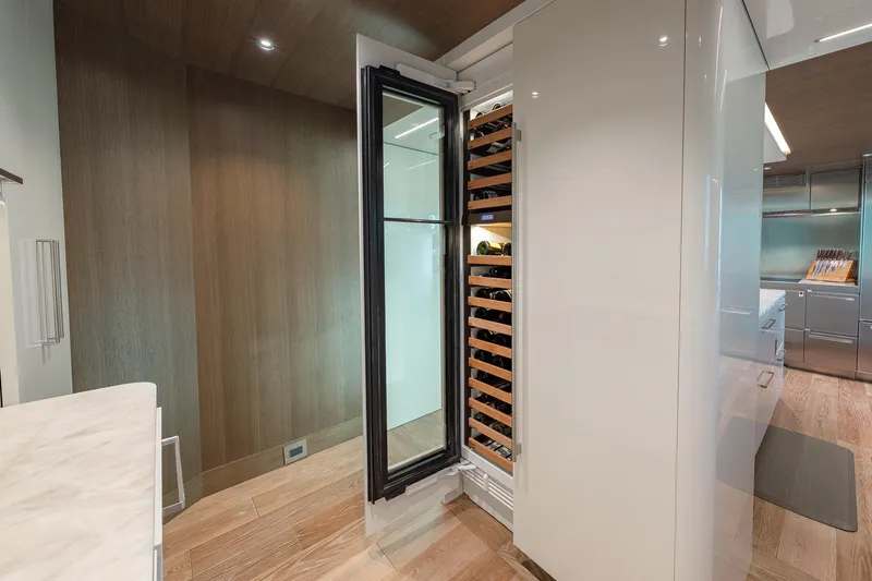 Serenity Yacht Photos Pics Luxurious 2018 Westport Raised Pilothouse yacht interior with open wine cooler.