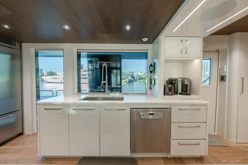 Serenity Yacht Photos Pics Modern kitchen interior on 2018 Westport Raised Pilothouse yacht with waterfront view.