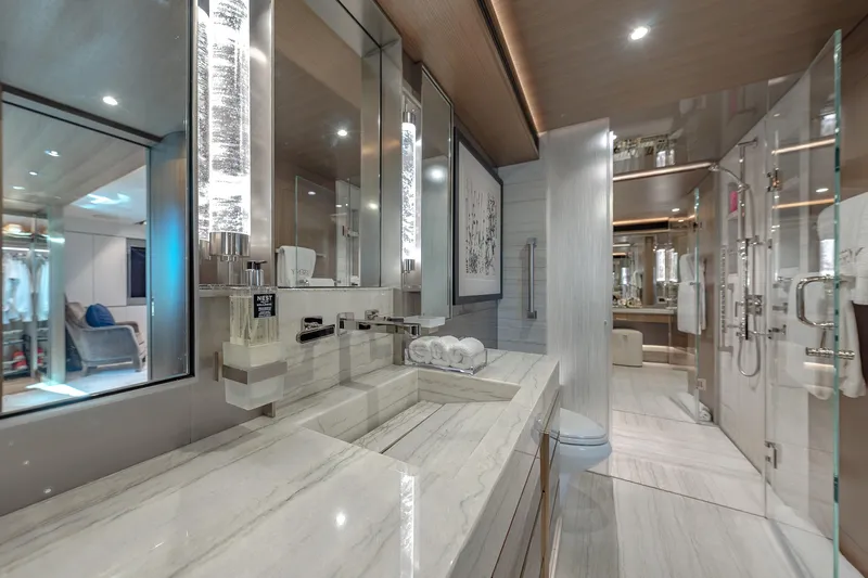Serenity Yacht Photos Pics Luxurious bathroom in 2018 Westport Raised Pilothouse yacht, featuring elegant marble and modern fixtures.