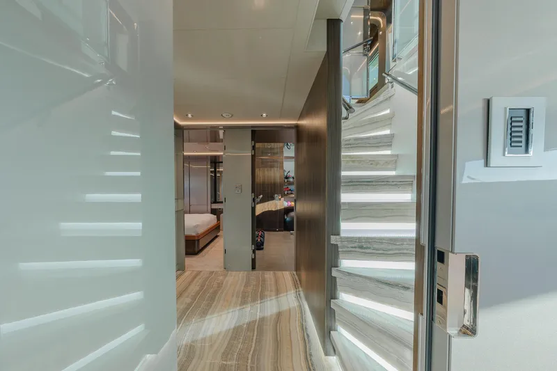 Serenity Yacht Photos Pics Luxurious interior of 2018 Westport Raised Pilothouse yacht with elegant staircase and modern design.