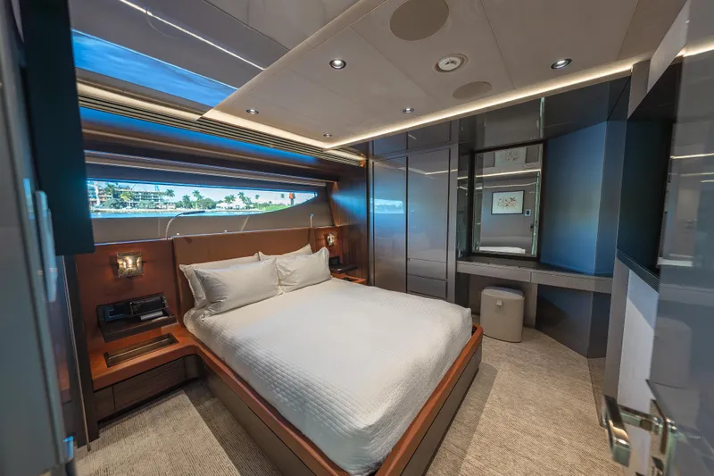 Serenity Yacht Photos Pics Luxurious bedroom interior of 2018 Westport Raised Pilothouse yacht with modern design and large window.