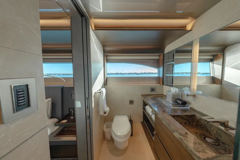 Serenity Yacht Photos Pics Luxurious 2018 Westport Raised Pilothouse yacht bathroom with elegant marble countertop and scenic window view.