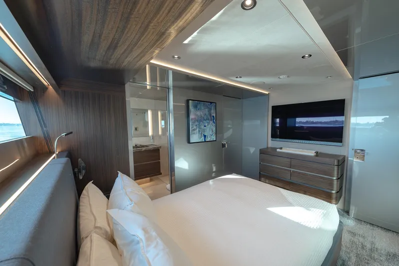 Serenity Yacht Photos Pics Luxurious bedroom in 2018 Westport Raised Pilothouse yacht with modern decor and ocean view.