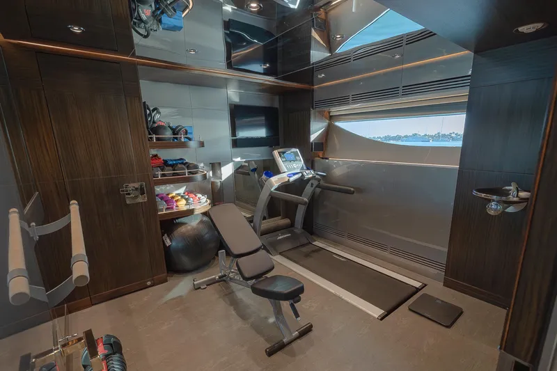 Serenity Yacht Photos Pics Luxurious gym on 2018 Westport Raised Pilothouse yacht with treadmill and weights.