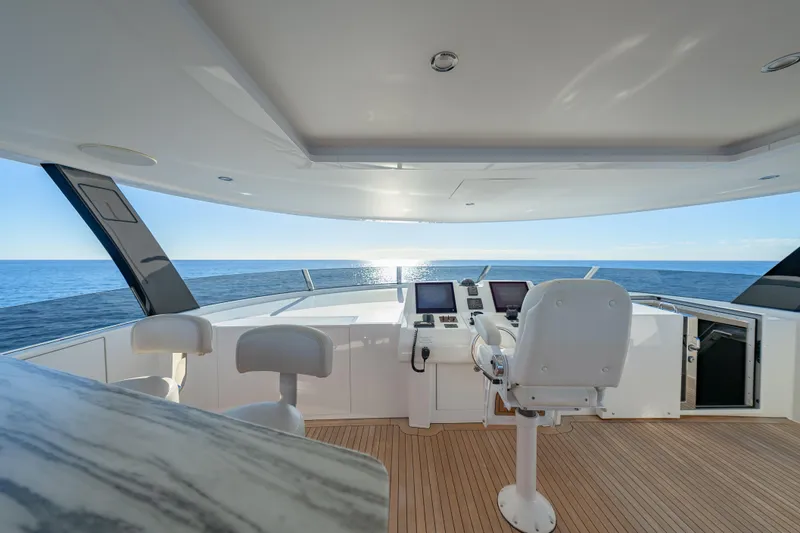 Serenity Yacht Photos Pics Luxurious 2018 Westport Raised Pilothouse yacht interior with ocean view and modern controls.