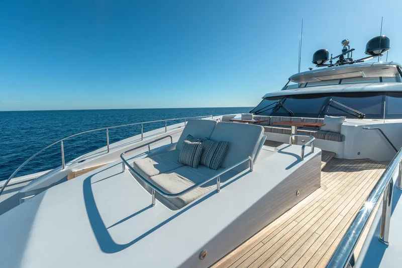 Serenity Yacht Photos Pics Luxurious 2018 Westport Raised Pilothouse yacht with sun deck, ocean view, and clear blue sky.