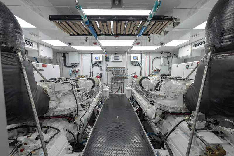 Serenity Yacht Photos Pics Engine room of 2018 Westport Raised Pilothouse yacht, featuring dual engines and modern equipment.