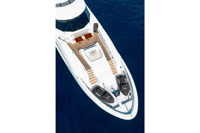 Serenity Yacht Photos Pics Aerial view of 2018 Westport Raised Pilothouse yacht on blue ocean water.