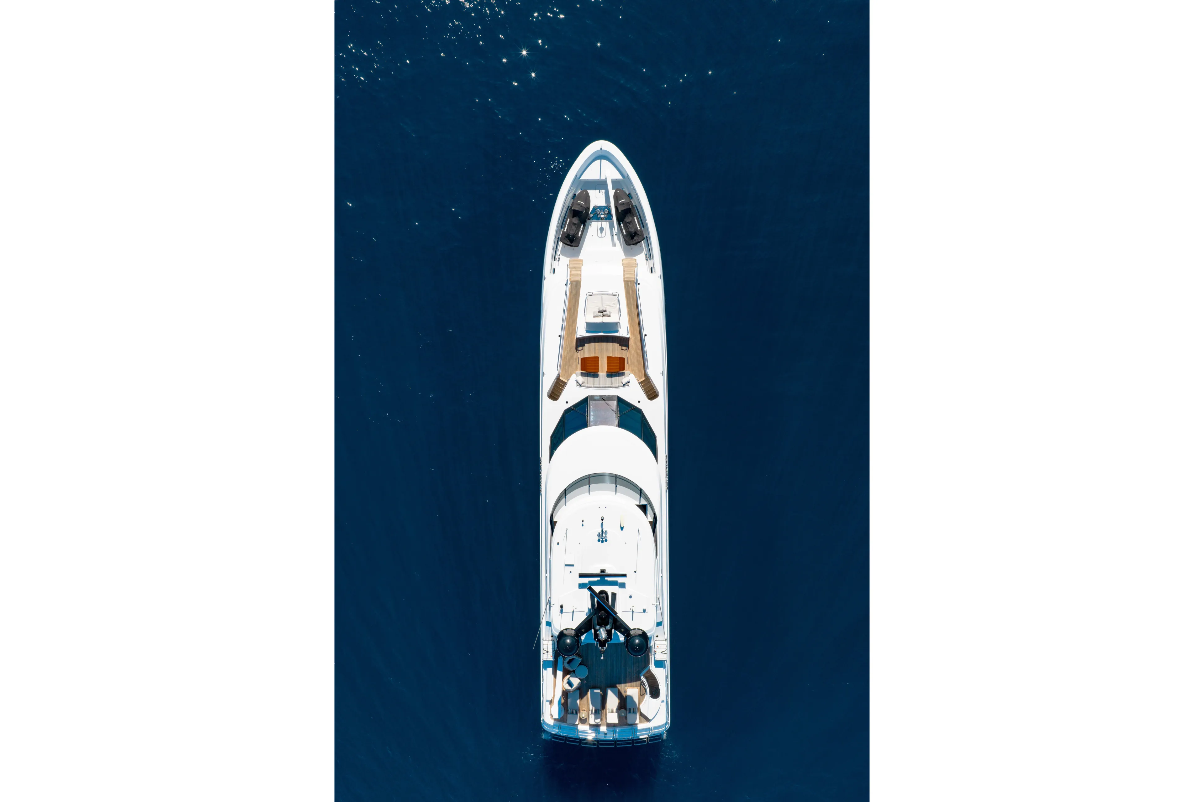Serenity Yacht Photos Pics Aerial view of 2018 Westport Raised Pilothouse yacht on deep blue water.