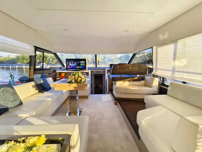  Yacht Photos Pics Luxurious interior of a 2022 Prestige 590 yacht with elegant seating and decor.