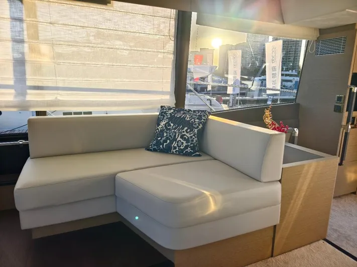  Yacht Photos Pics Luxurious interior of 2022 Prestige 590 yacht with elegant seating and decor.